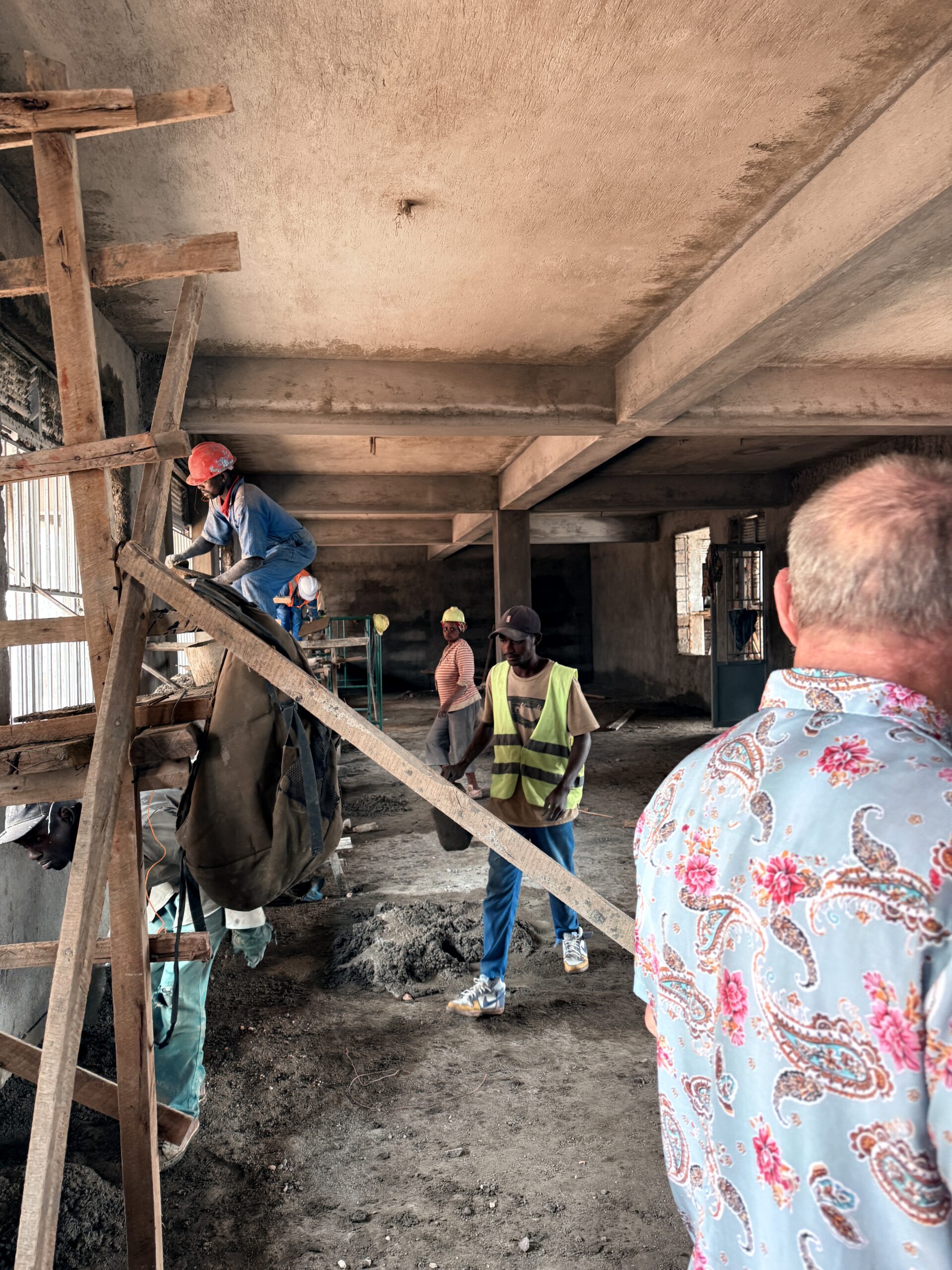 Bill on a Rwandan construction worksite alongside local workers