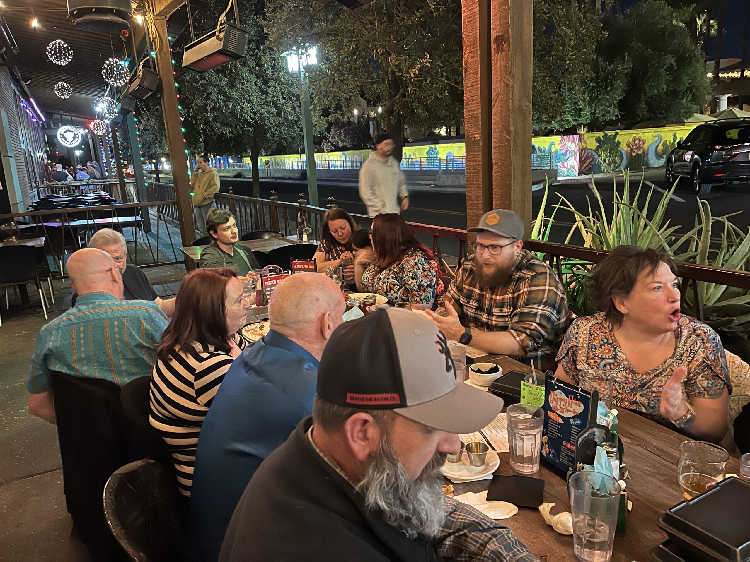 The long table — community gathered at dinner on a Chandler patio