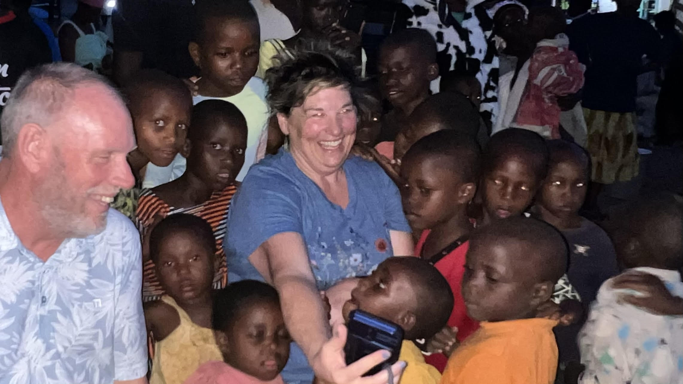 Surrounded by children, Rwanda