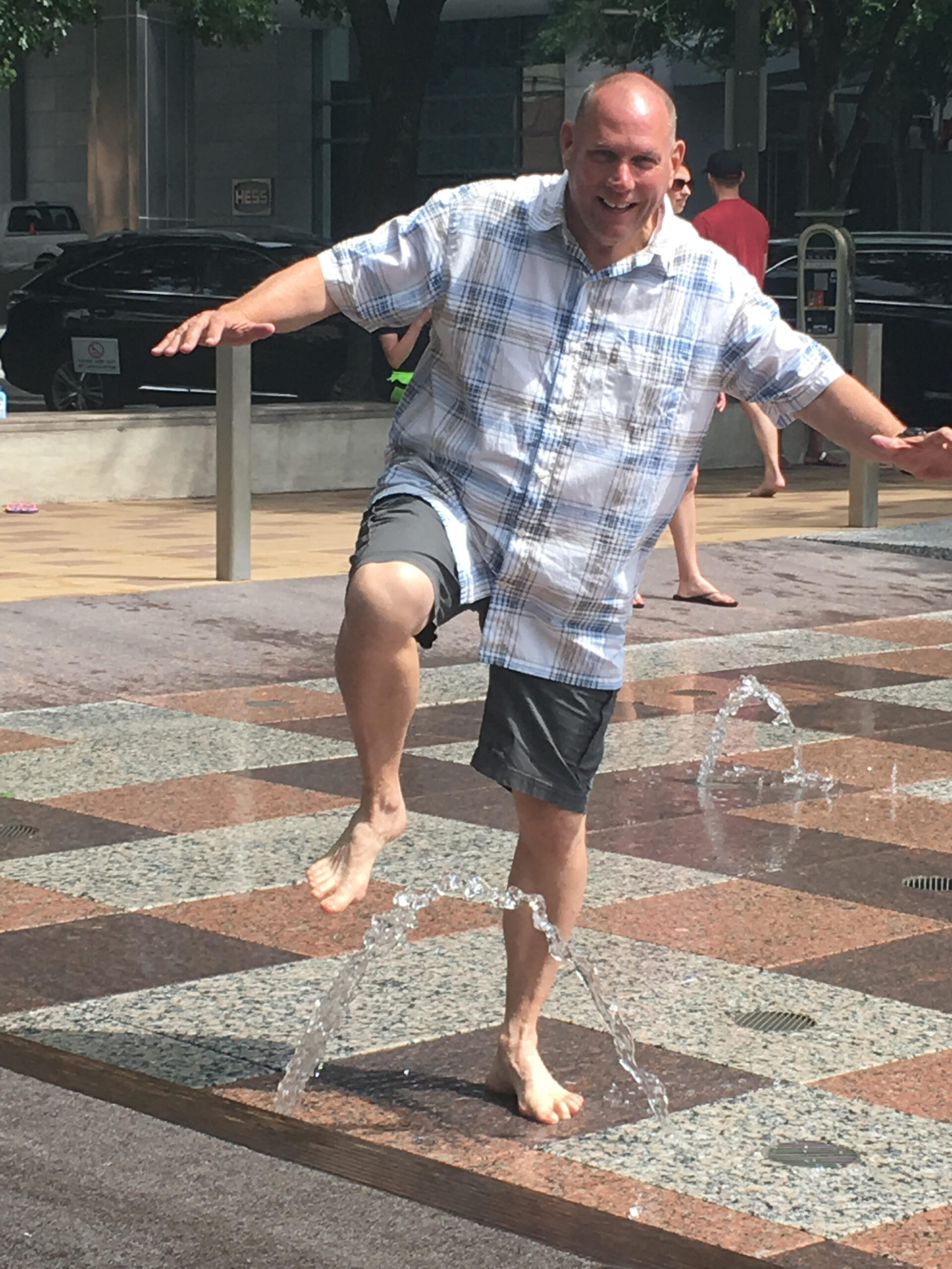Bill barefoot in a downtown fountain